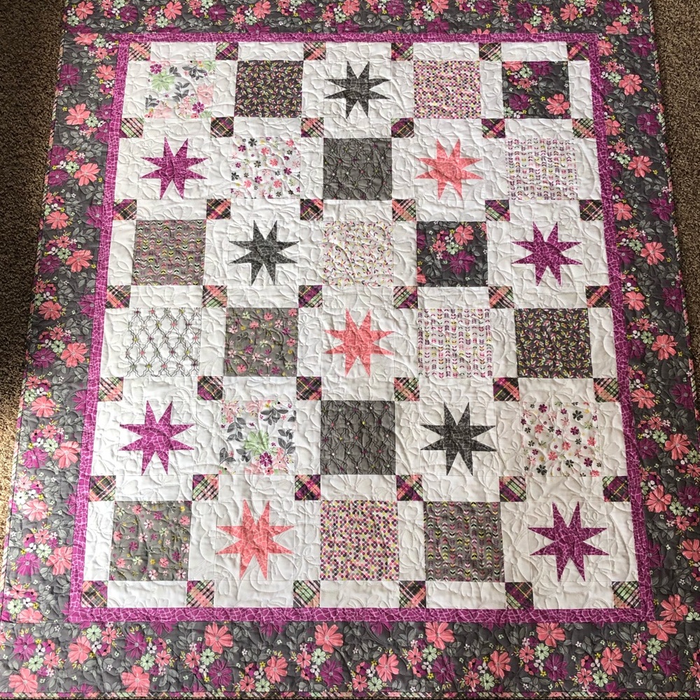 Floral Rock My Star Way throw sized quilt.